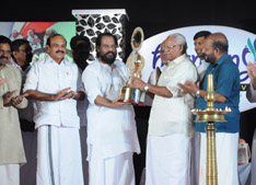 Honarable Minister C.N. Balakrishnan awards first Harmony festival Award to Padmasree K. J. Yesudas.